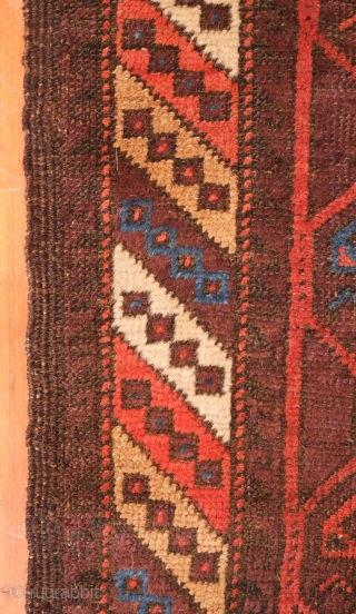 Aimaq "Baluch" Rug, Late 19th Century.  Dokhtar-e Ghazi variant design.  The repeat floral motif is also similar to those that appear on Seljuk rugs.  The repeated pattern is broken  ...