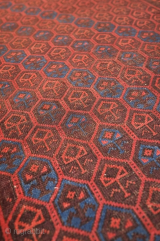 Aimaq "Baluch" Rug, Late 19th Century.  Dokhtar-e Ghazi variant design.  The repeat floral motif is also similar to those that appear on Seljuk rugs.  The repeated pattern is broken  ...