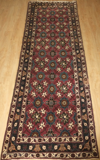 Veramin Runner, 1920s. Wonderful deep rich purple-red ground and overall Mina Khani-like floral pattern.  The pile is thick.  There is one small section of repair on the right side excellently  ...