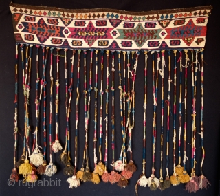 Malatya Kurdish hanging.  Late 19th Century.  Long tassels wrapped in naturally dyed wool ending in beautifully colored tufts.  Great natural colors overall.  It is an unusual piece that  ...