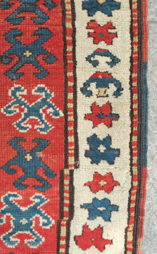 Kazak prayer rug, dated to about 1876. The date is inscribed at the top of the mihrab. 
Note the abstracted beast to the left of the top of the mihrab. Also note  ...
