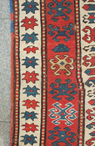 Kazak prayer rug, dated to about 1876. The date is inscribed at the top of the mihrab. 
Note the abstracted beast to the left of the top of the mihrab. Also note  ...