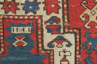 Kazak prayer rug, dated to about 1876. The date is inscribed at the top of the mihrab. 
Note the abstracted beast to the left of the top of the mihrab. Also note  ...