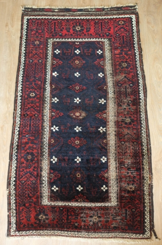 Baluch Rug, possibly Kashmar area Khorasan, Mid to 3rd quarter of the 19th Century.  Very dark brooding tones of blue and deep rich red.  Birds interspersed throughout the mina khani  ...