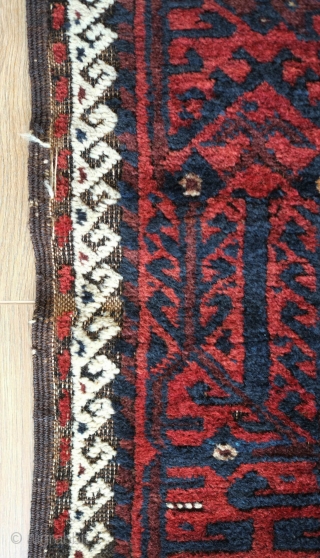 Baluch Rug, possibly Kashmar area Khorasan, Mid to 3rd quarter of the 19th Century.  Very dark brooding tones of blue and deep rich red.  Birds interspersed throughout the mina khani  ...