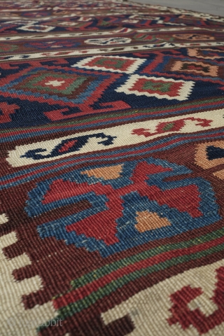 Veramin or Shiraz Kilim, Late 19th Century, great condition and colors. Subtle assymetry in the design with four kochaks in the upper bands and five in the lower bands as well as  ...