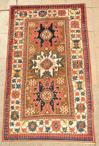 Lesghi Star Rug, 3rd to 4th quarter of the 19th century.  The stars appear to float on top of the ground field.  The main border is in a beautiful rosette  ...