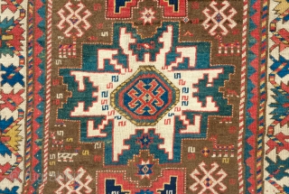 Lesghi Star Rug, 3rd to 4th quarter of the 19th century.  The stars appear to float on top of the ground field.  The main border is in a beautiful rosette  ...