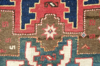 Lesghi Star Rug, 3rd to 4th quarter of the 19th century.  The stars appear to float on top of the ground field.  The main border is in a beautiful rosette  ...