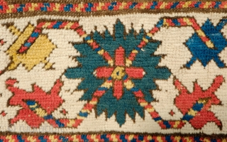 Lesghi Star Rug, 3rd to 4th quarter of the 19th century.  The stars appear to float on top of the ground field.  The main border is in a beautiful rosette  ...