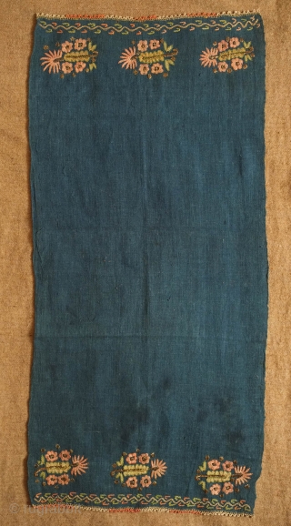 Ottoman yaglik or napkin, indigo blue dyed ground, 19th century. The embroidery is silk and metallic foil.  The indigo blue ground material is very rare among these. 40 x 84 cm 