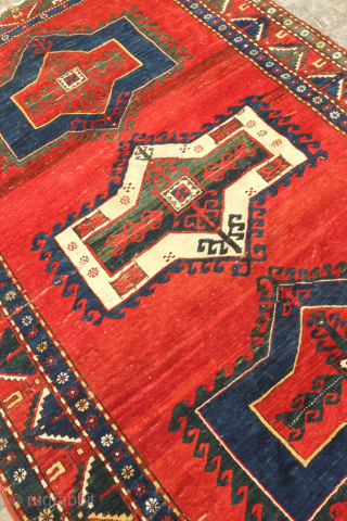 Kazak rug, late 19th century.  Deeply saturated colors with fluidly drawn serrated decagons. The organic quality of these medallions and other design elements almost gives this rug the feel of a  ...