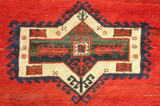 Kazak rug, late 19th century.  Deeply saturated colors with fluidly drawn serrated decagons. The organic quality of these medallions and other design elements almost gives this rug the feel of a  ...