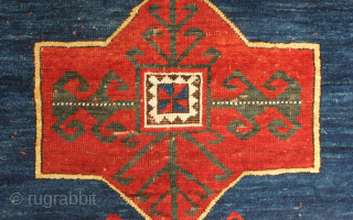 Kazak rug, late 19th century.  Deeply saturated colors with fluidly drawn serrated decagons. The organic quality of these medallions and other design elements almost gives this rug the feel of a  ...