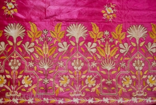 Edirne Bed Valance, 19th Century.  Silk and metallic chain stitch on a silk ground cloth. The design is in a symmetrical floral arrangement reminiscent of Mughal floral designs. The backing is  ...