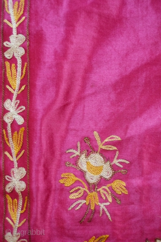 Edirne Bed Valance, 19th Century.  Silk and metallic chain stitch on a silk ground cloth. The design is in a symmetrical floral arrangement reminiscent of Mughal floral designs. The backing is  ...