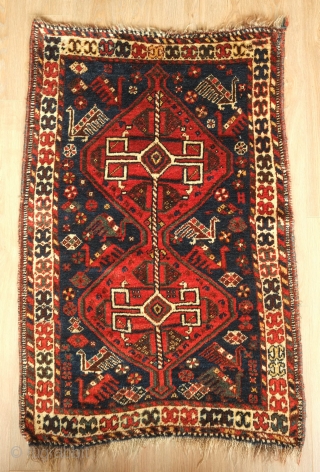 Shiraz area small rug, Late 19th or early 20th century.  Thick, lush pile.  Excellent condition.  Original selvedges. Atypical size.  Wonderful bird motifs scattered about. 
83 x 123 cm 