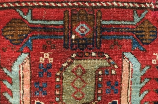 Heriz-Karadagh mafrash panel, 19th century.  Excellent colors.  Serrated leaf or mahi motifs flanking botehs.  A small repair on the top right corner. 112 x 48 cm.    