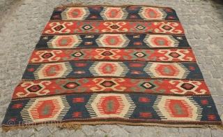 Borchalo Kazak kilim, 19th century.  Wide bands.  Fingered medallions.  Good age and colors. A hole at the top which can easly be repaired.  176 x 209 cm   ...