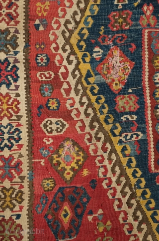 Central Anatolian Kilim, mid-19th century.  A blitz of colors.  Strongly archaic designs.  Very ethnographic and filled with portent. Rare type. 183 x 310 cm.      