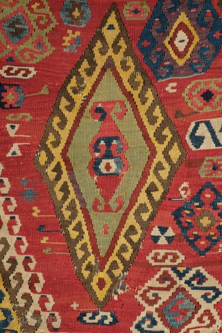 Central Anatolian Kilim, mid-19th century.  A blitz of colors.  Strongly archaic designs.  Very ethnographic and filled with portent. Rare type. 183 x 310 cm.      