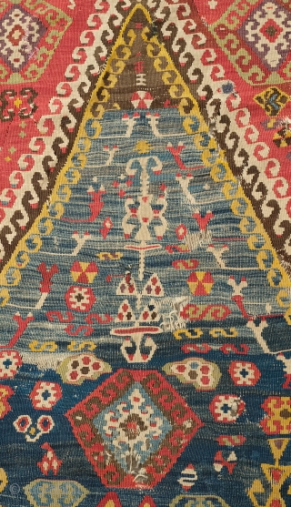 Central Anatolian Kilim, mid-19th century.  A blitz of colors.  Strongly archaic designs.  Very ethnographic and filled with portent. Rare type. 183 x 310 cm.      