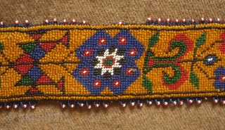 Sivas area glass beaded belt from the 1920s to 1930s. Yellow ground. Beautifully articulated floral motifs, Turkmen gol-like medallions and a rooster on each end.  Leather backing.  5.5 x 74  ...