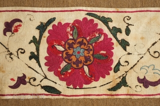 Uzbek suzani border fragment, 3rd to 4th quarter of the 19th century.  A few of the inner petals are in wool some of which has corroded due to a corrosive quality  ...