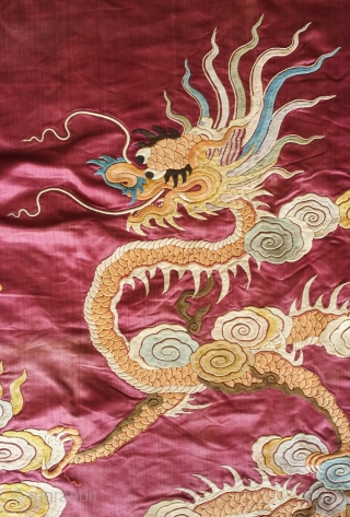 Qing Chinese hanging, late 19th century. The fabulous peacock tands with opened tail in exceptional embroidered detail with two dragons facing each other above.  The dragons are four clawed and are  ...