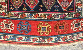 Genje rug, 19th century.  A real blitz of color on a midnight indigo field.  Pink, purple, apricot, green - at least 11 colors.  Overall good condition with two small  ...
