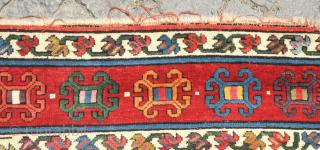 Genje rug, 19th century.  A real blitz of color on a midnight indigo field.  Pink, purple, apricot, green - at least 11 colors.  Overall good condition with two small  ...