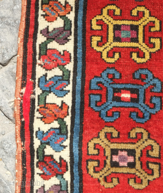 Genje rug, 19th century.  A real blitz of color on a midnight indigo field.  Pink, purple, apricot, green - at least 11 colors.  Overall good condition with two small  ...