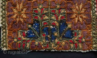 Bethlehem or Ramallah Embroidery Panel, early 20th century.  Thick floss silk embroidery creating a rich and sumptuous effect.  Probably a panel from a dress.  Beautiful floral motifs in vases.  ...