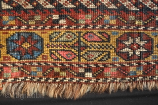 Lori or Khamseh mafrash panel, 19th century. Mezmerizing zigzag design surrounded by a yellow border of eight-pointed stars in florettes and botehs arranged in a floral form.  Some repiling in the  ...