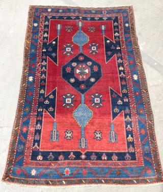 Kazak, Early 1900s.  Wonderful colors and some abrash on the bottom end.  Good pile. A beautiful decorative rug.  144 x 231 cm.        