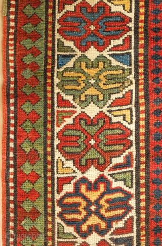 Kazak or Moghan rug, 4th quarter of the 19th century.  Simple, large Memling gul design and a stunning array of colors.  Wonderful lobbed floral border.  159 x 200 cm 