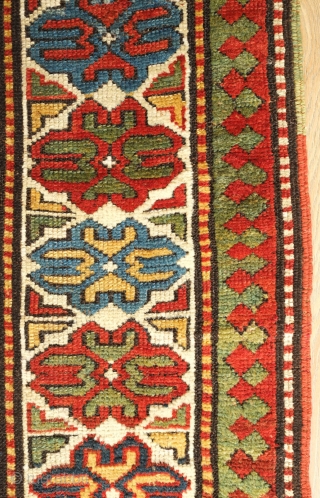 Kazak or Moghan rug, 4th quarter of the 19th century.  Simple, large Memling gul design and a stunning array of colors.  Wonderful lobbed floral border.  159 x 200 cm 