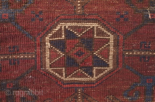 Baluch saddle bag face, late 19th century.  The central motif is in four abstracted dragon motifs surrounding an eight-pointed star.  The outer border is in a repeating swastika motif harkening  ...