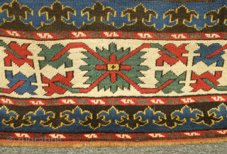 Kazak rug, 19th century.  Excellent weave and good colors including a wonderful yellow-green and purple.  Crisp drawing. Lower pile but otherwise excellent condition.  143 x 230 cm   