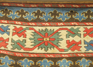 Kazak rug, 19th century.  Excellent weave and good colors including a wonderful yellow-green and purple.  Crisp drawing. Lower pile but otherwise excellent condition.  143 x 230 cm   