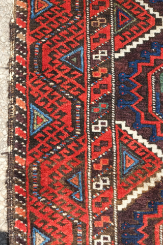Baluch rug, Khorasan, 19th century.  Salor guls and a rich array of colors including purple and seafoam green.  Parts of the selvedge need some re-wrapping. 96 x 165 cm  