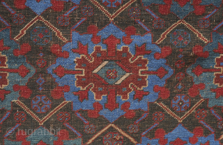 Afshar rug, 19th century. Large florals in an electric blue and deep green on a black ground. Pile is low with corrosion in the black but it is all there. ...