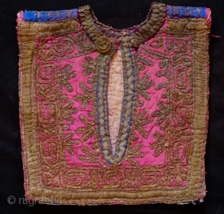 Pashtun Mangal, Paktika Child's Vest (I believe), Late 19th Century.  Cotton base material with green and red silk face.  Silk embroidery on the back side with a bead band on  ...