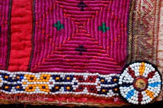 Pashtun Mangal, Paktika Child's Vest (I believe), Late 19th Century.  Cotton base material with green and red silk face.  Silk embroidery on the back side with a bead band on  ...