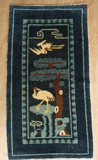 Pao Tao Rug, C. 1900 or so.  Very soft wool.  Two crane figures symbolizing longevity. Wonderful fleur de lis-like motifs for the inner border.  The cloud at the top  ...