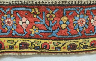 Bijar rug, 19th century.  Vivid colors, abstract pendants with rings of colors and human and small animal figures littering the field.  128 x 156 cm      