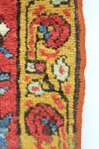 Bijar rug, 19th century.  Vivid colors, abstract pendants with rings of colors and human and small animal figures littering the field.  128 x 156 cm      