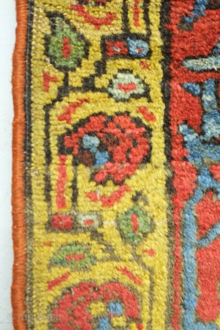 Bijar rug, 19th century.  Vivid colors, abstract pendants with rings of colors and human and small animal figures littering the field.  128 x 156 cm      