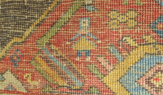 Bijar rug, 19th century.  Vivid colors, abstract pendants with rings of colors and human and small animal figures littering the field.  128 x 156 cm      