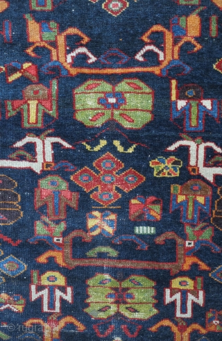 Bakhtiyari Rug, fourth quarter of the 19th century.  Extraordinary colors and floral and abstracted animal motifs. Very striking border.  Some condition issues but most of the pile is decent with  ...